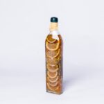 Sliced marinated orange in bottle